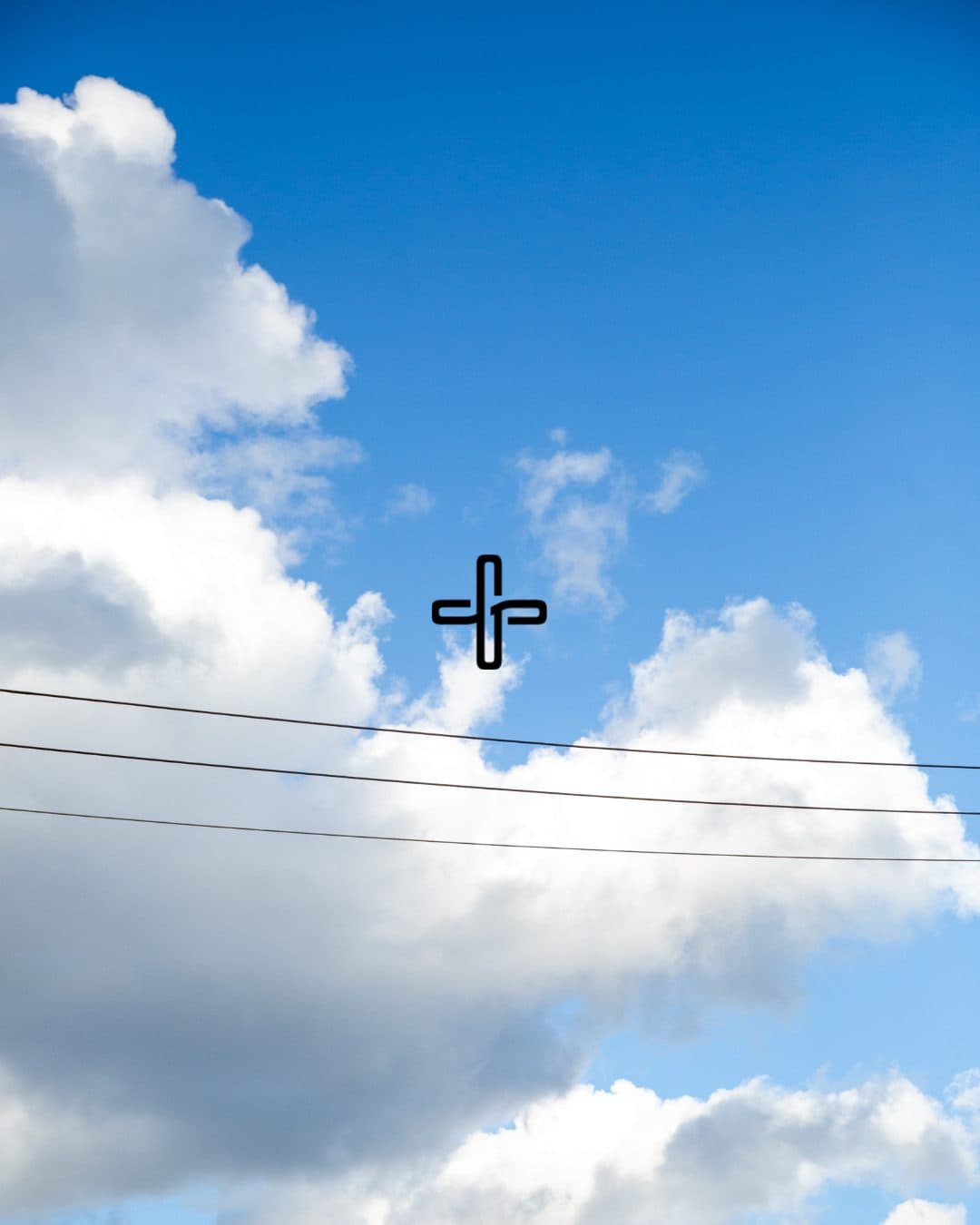 Blue sky and clouds over Vancouver with The Gospel Supply mark